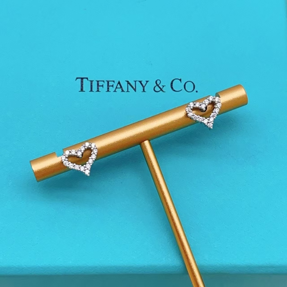 Tiffany & Co. Silver Stud Earrings Set with Diamond Inlays